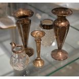 A pair of silver spill vases, another smaller similar