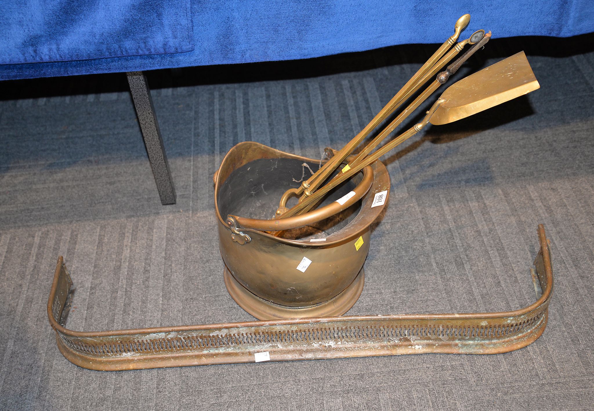 A Victorian brass coal scuttle, a set of three Victorian brass fire tools