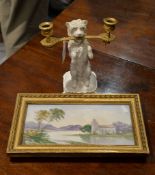 An English white porcelain model of a dog with two-branch gilt metal...