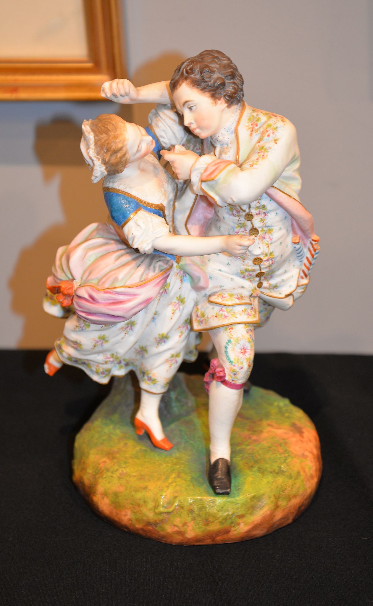 A French bisque porcelain group of two figures dancing, 26cm high