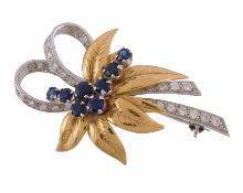 An 18 carat gold sapphire and diamond foliate brooch, of foliate design set with a cluster of