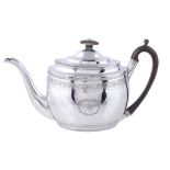 A George III silver oval tea pot by Thomas Wallis II, London 1804, with a stained ivory finial, a
