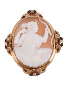 A Victorian shell cameo brooch, circa 1880, the oval panel carved with the relief of Diana with bow