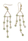 A pair of peridot earrings, the pendants set with circular cut peridots suspended from belcher