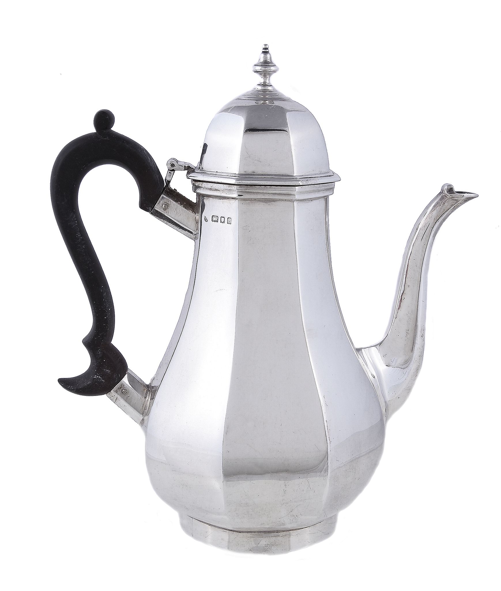 A silver octagonal baluster coffee pot by C. S. Harris & Sons Ltd., London 1924, with a bell shaped