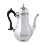 A silver octagonal baluster coffee pot by C. S. Harris & Sons Ltd., London 1924, with a bell shaped