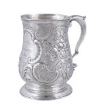 A late George II silver baluster mug by William Shaw & William Priest, London 1755, with a leaf-