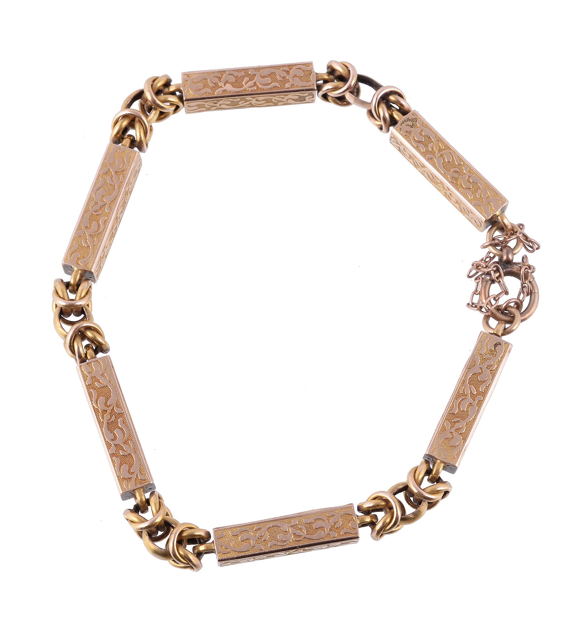 A Victorian gold coloured fancy link bracelet, circa 1880, with decorative baton links with knotted