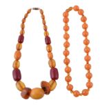 An amber bead necklace, the circular amber beads with smaller amber beads in between, with a screw