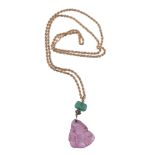 A Chinese pink tourmaline pendant, carved as a bat on a gourd, suspended from a green glass bead,