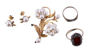 A cultured pearl brooch, designed as a foliate spray, set with clusters of cultured pearls, stamped