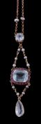 An aquamarine, ruby and seed pearl necklace, the rectangular cut aquamarine claw set within a