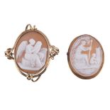 A Victorian shell cameo brooch, circa 1880, the oval panel carved with a recording angel, within a