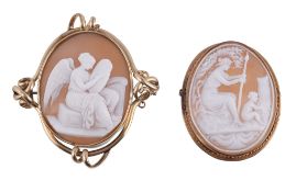 A Victorian shell cameo brooch, circa 1880, the oval panel carved with a recording angel, within a