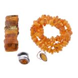 An amber bead necklace, composed with tumbled amber beads, with a screw clasp, 61cm long; together