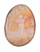 A Victorian shell cameo brooch, the oval panel carved with cupid standing cradling a dove, his