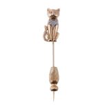 A diamond set cat stick pin, the seated cat set with eight cut diamonds, 5.7cm long