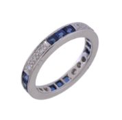 A sapphire and diamond eternity ring, set with alternating square cut sapphires and brilliant cut