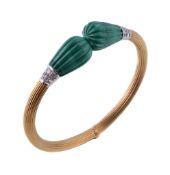 A malachite and diamond hinged bangle, the fluted arms to the carved malachite terminals accented