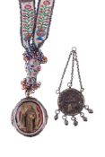 A Spanish or Spanish colonial oval double sided devotional pendant, inset with a full length