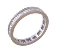 A diamond eternity ring, set with baguette cut diamonds, approximately 0.80 carat total, stamped