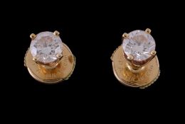 A pair of diamond ear studs, the brilliant cut diamonds, estimated to weigh 0.72 carats total, with