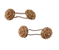 A pair of cannetille cufflinks, the circular panels of domed cannetille design, 1.1cm diameter,5.5g