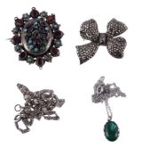 A marcasite ribbon bow brooch, 4cm wide; a gem set locket brooch, set with vari cut garnets and