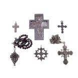 A collection of crosses, including: one with dried plant material under bevelled glass, engraved