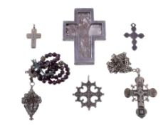 A collection of crosses, including: one with dried plant material under bevelled glass, engraved