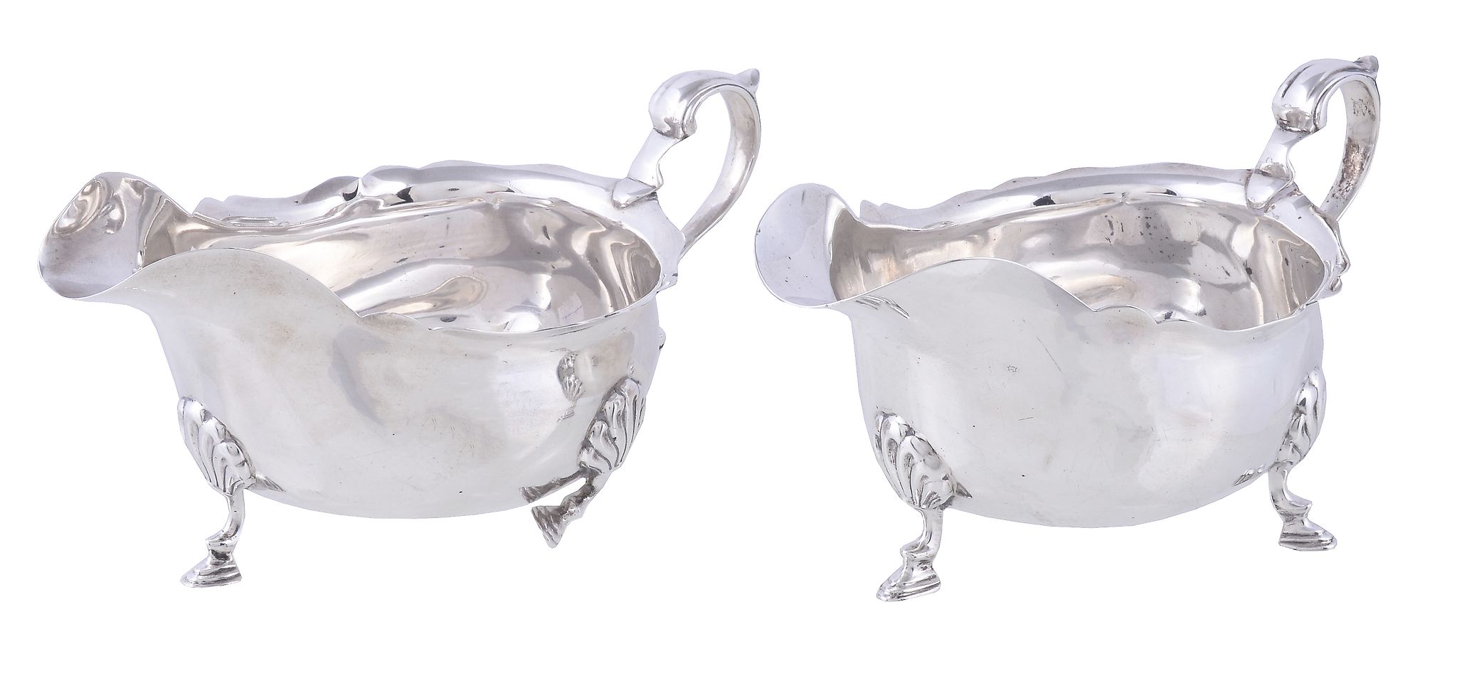 A matched pair of silver oval sauce boats by Elkington & Co., Birmingham 1919 and 1920, with