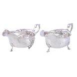 A matched pair of silver oval sauce boats by Elkington & Co., Birmingham 1919 and 1920, with