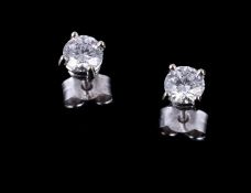 A pair of diamond ear studs, the brilliant cut diamonds, stated to weigh 0.30 carats and 0.31