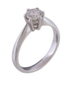 An 18 carat gold single stone diamond ring, the brilliant cut diamond estimated to weigh 0.70