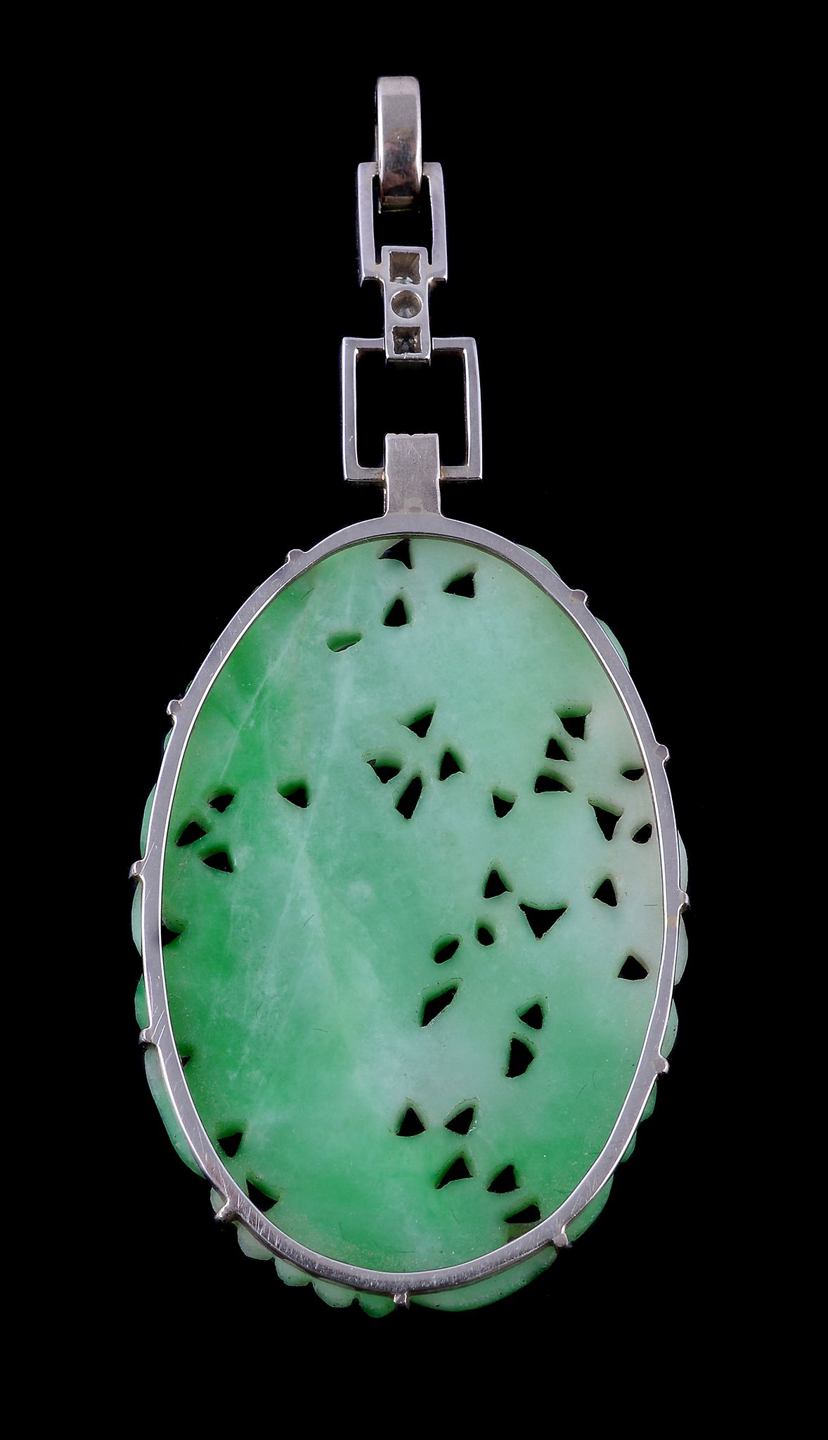 A 1950s jadeite jade and diamond pendant, the oval jadeite jade panel carved with foliage, - Image 2 of 2