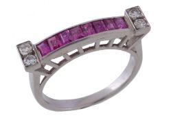 A 1940s ruby and diamond ring, the panel of rectangular cut rubies channel set between eight cut