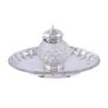 A Victorian silver oval inkstand, apparently no maker's mark, London 1863, with a hobnail cut glass