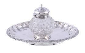 A Victorian silver oval inkstand, apparently no maker's mark, London 1863, with a hobnail cut glass