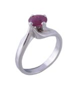 A ruby single stone ring, the oval cut ruby in a four claw setting, stamped 750 with Italian