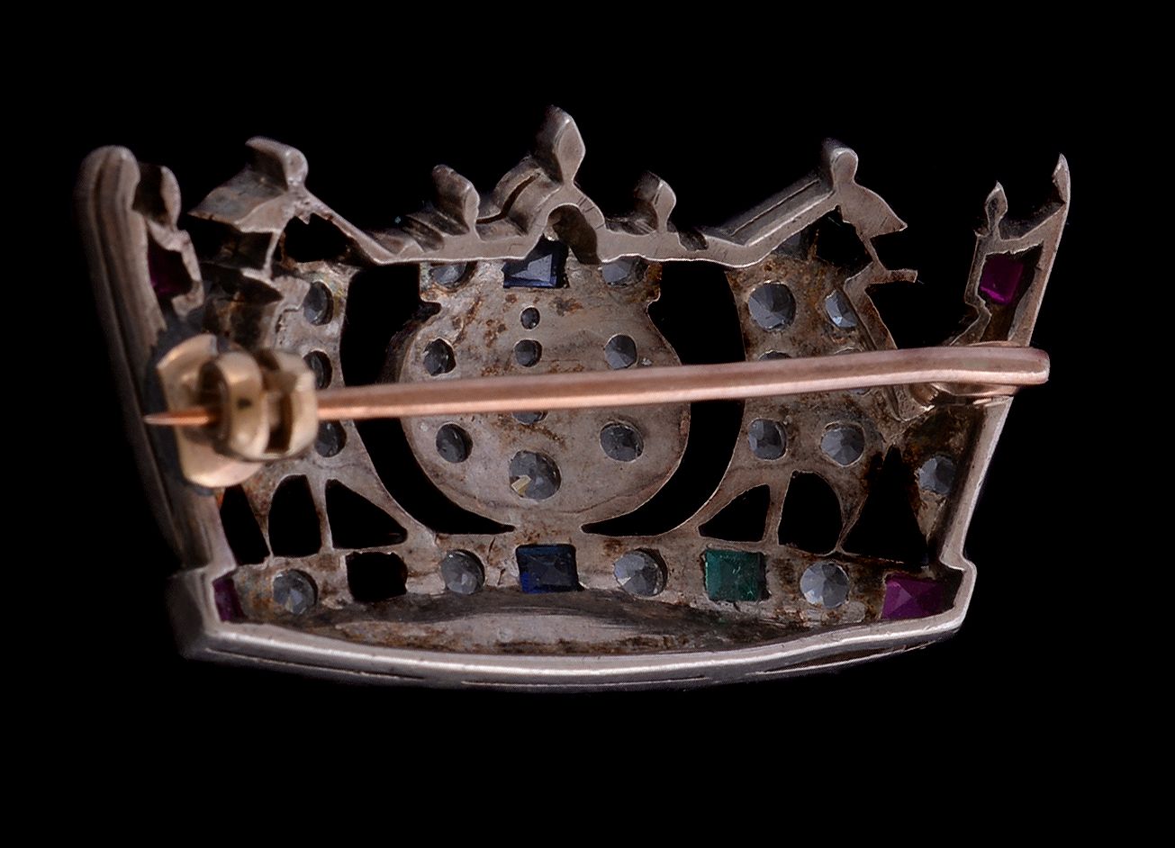 A white spinel, synthetic sapphire and ruby Naval coronet brooch, set with circular cut white - Image 2 of 2