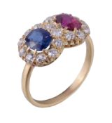 A late Victorian ruby, sapphire and diamond double cluster ring, circa 1900, the oval cut ruby and