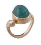 A 1980s emerald serpent ring, the oval cabochon emerald collet set on the shank modelled as a