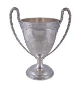 A silver twin handled pedestal cup by West & Son of Dublin, London 1911, with ribbon bound reeded