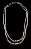 A two row cultured pearl necklace, composed of graduating cultured pearls, to the clasp set with