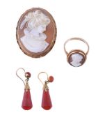 A pair of cornelian earrings, the facetted cornelian drops with a decorative cap, with shepherd's