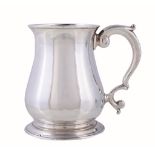 A late George II silver baluster mug by John Payne, London 1752, with a tongue-capped double scroll