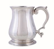 A late George II silver baluster mug by John Payne, London 1752, with a tongue-capped double scroll