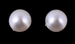 A pair of cultured pearl ear studs, the cultured pearls, measuring approximately 7mm diameter, with