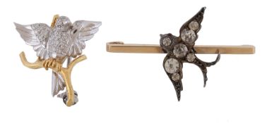 An 18 carat gold diamond set bird brooch, the bird set with brilliant cut diamonds, perched upon a