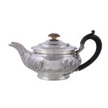 A late George III silver compressed spherical tea pot by Joseph Angell I, London 1816, with a